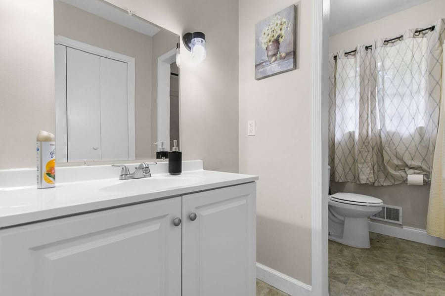 Clean, bright, and functional, this fully stocked bathroom provides a comfortable space to get ready or wind down.