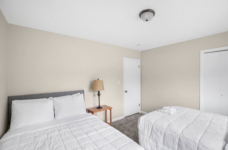 The third double full bedroom continues the home's theme of comfort and flexibility, offering two full beds in a space that feels both relaxed and welcoming-perfect for guests to settle in and make it their own.