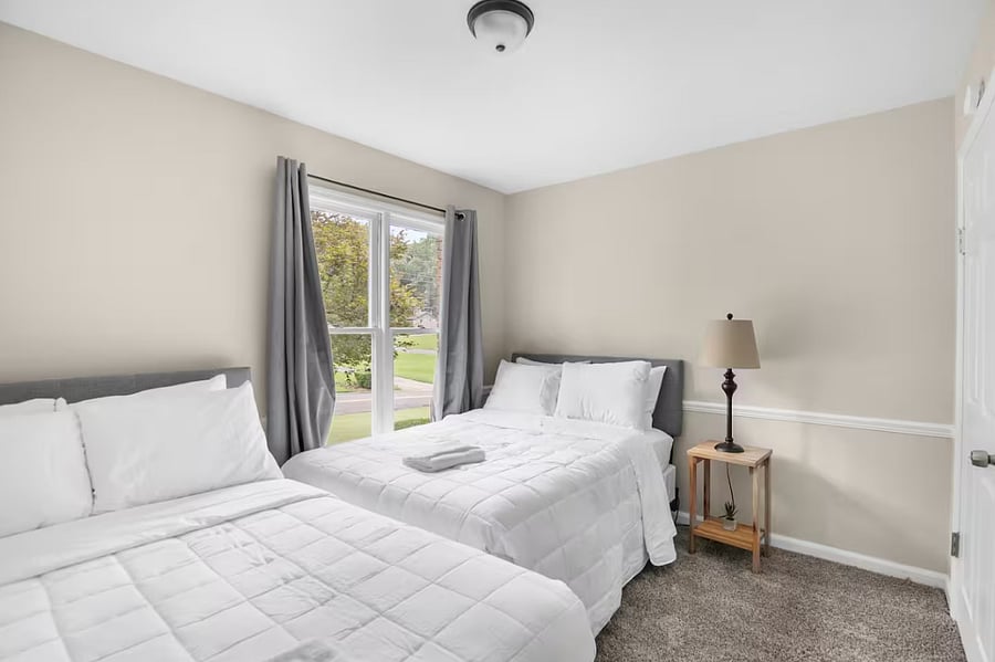 Clean lines and a spacious layout make this room feel open and relaxed. With two full beds, it's ideal for groups traveling together while still offering a sense of personal space.
