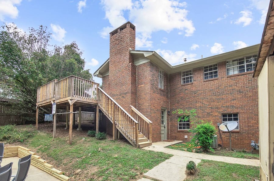 A gentle set of stairs leads from the back patio down into the spacious yard, revealing just how much room you have to enjoy. Fully fenced and thoughtfully laid out, it's ideal for both quiet moments and group gatherings.