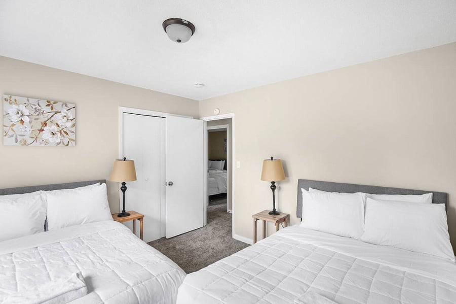 Clean lines and a spacious layout make this room feel open and relaxed. With two full beds, it's ideal for groups traveling together while still offering a sense of personal space.