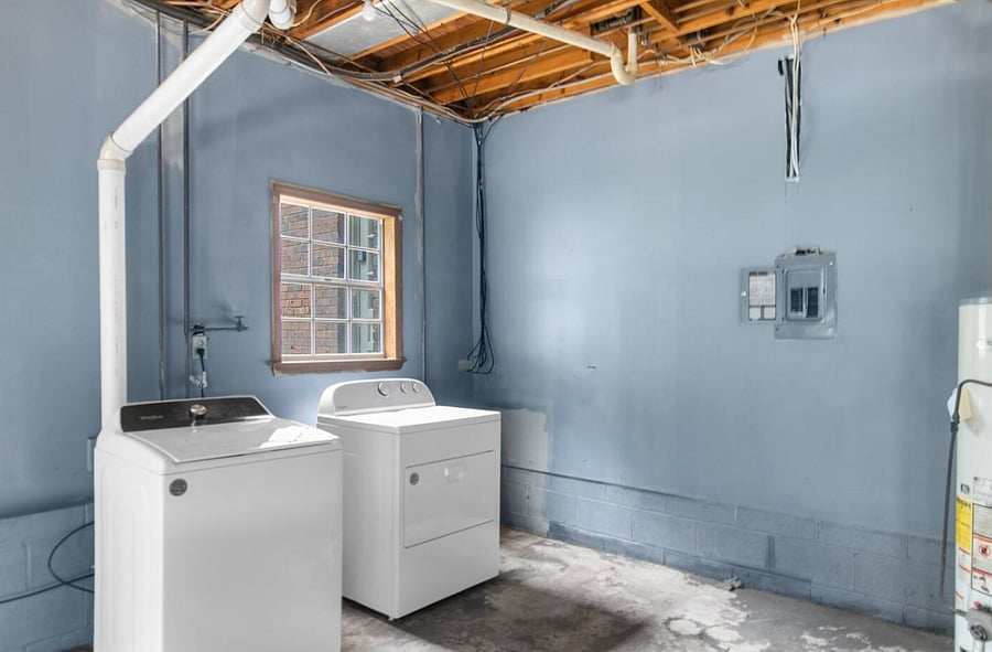 The laundry area is conveniently located in the garage, making it easy to refresh clothes during your stay-especially helpful for longer visits or groups needing a quick, practical reset.