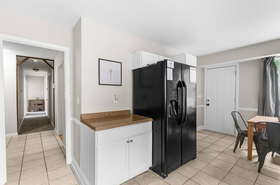 Tucked into the kitchen area, the dining table for four creates a natural place to pause, eat, and connect-right in the heart of the home.