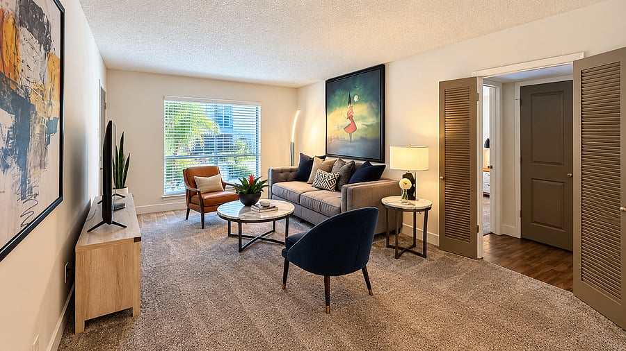Comfortable, fully furnished living area with stylish seating, abundant natural light, and an open layout designed for relaxing and everyday living.