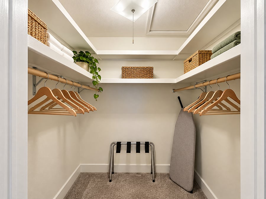 Spacious closet with ample hanging space and shelving, providing convenient storage for clothing, luggage, and personal belongings.