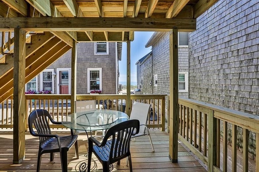 1st floor deck facing the ocean...steps from the sand