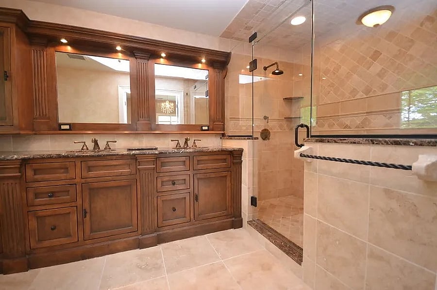 Master Bath w/double vanity and dual showerheads and bench seating.