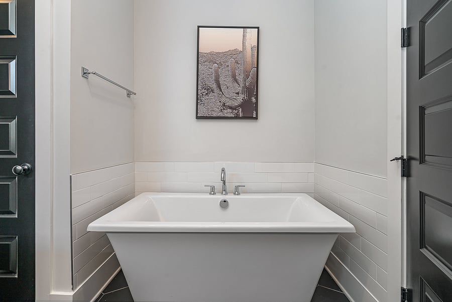 Private ensuite bathroom attached to Bedroom 1, featuring a spacious double vanity, walk-in shower and large tub.