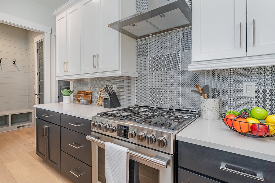 A fully equipped kitchen featuring stainless steel appliances, seating for four at the island, and all the essentials you need to cook and dine at home.
