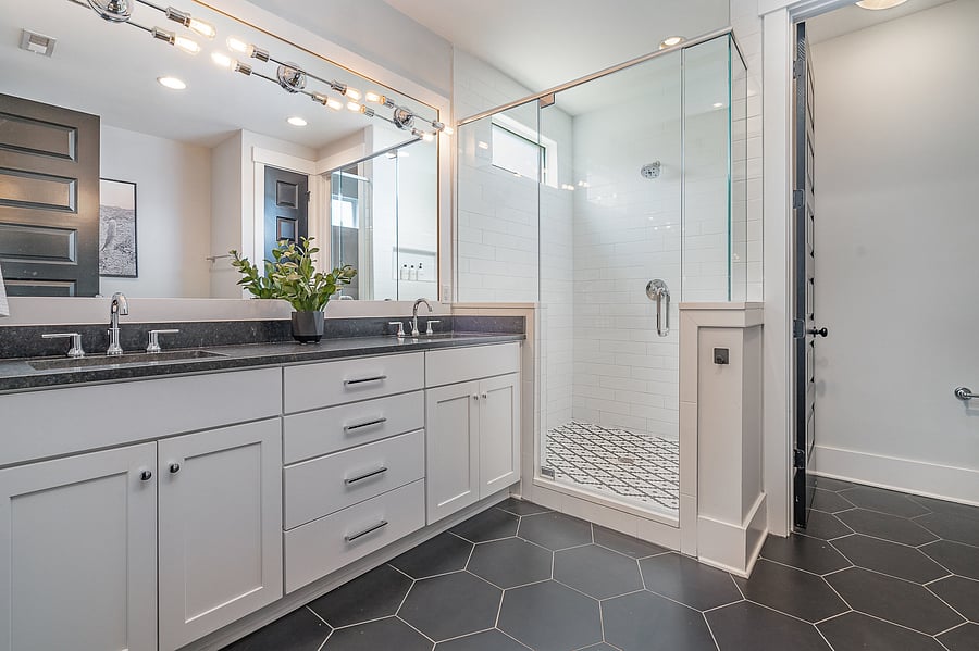 Private ensuite bathroom attached to Bedroom 1, featuring a spacious double vanity, walk-in shower and large tub.