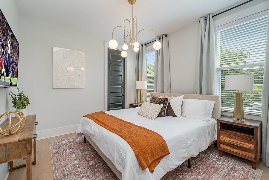 Bedroom 1 features a comfortable Queen bed, Smart TV, dresser, and closet. Located on the 2nd floor.