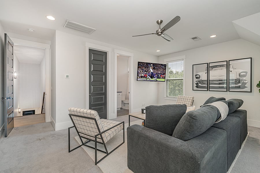 Additional living room on the 3rd floor with attached bathroom, Smart TV, and 2 twin beds.
