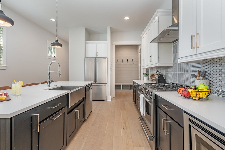 A fully equipped kitchen featuring stainless steel appliances, seating for four at the island, and all the essentials you need to cook and dine at home.