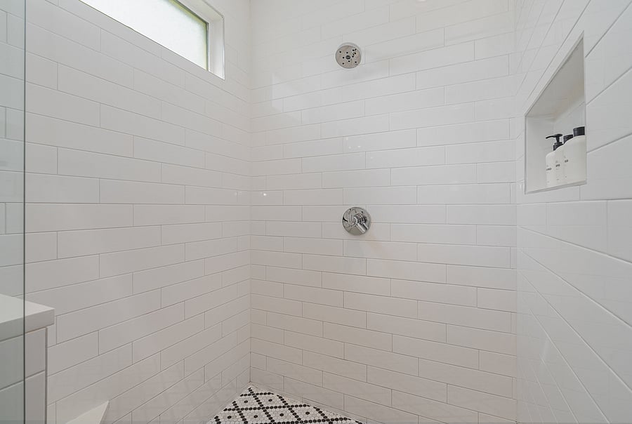 Private ensuite bathroom attached to Bedroom 1, featuring a spacious double vanity, walk-in shower and large tub.