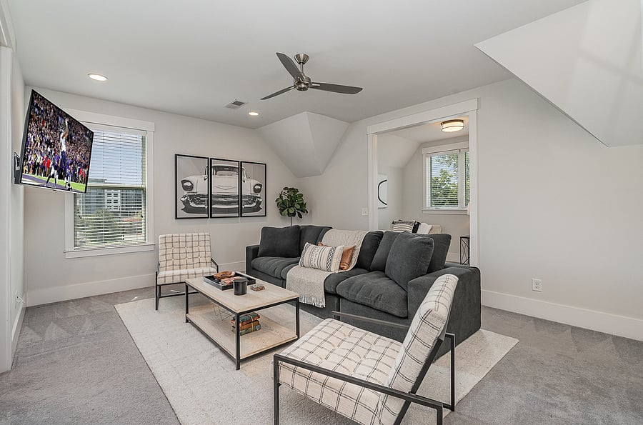 Additional living room on the 3rd floor with attached bathroom, Smart TV, and 2 twin beds.