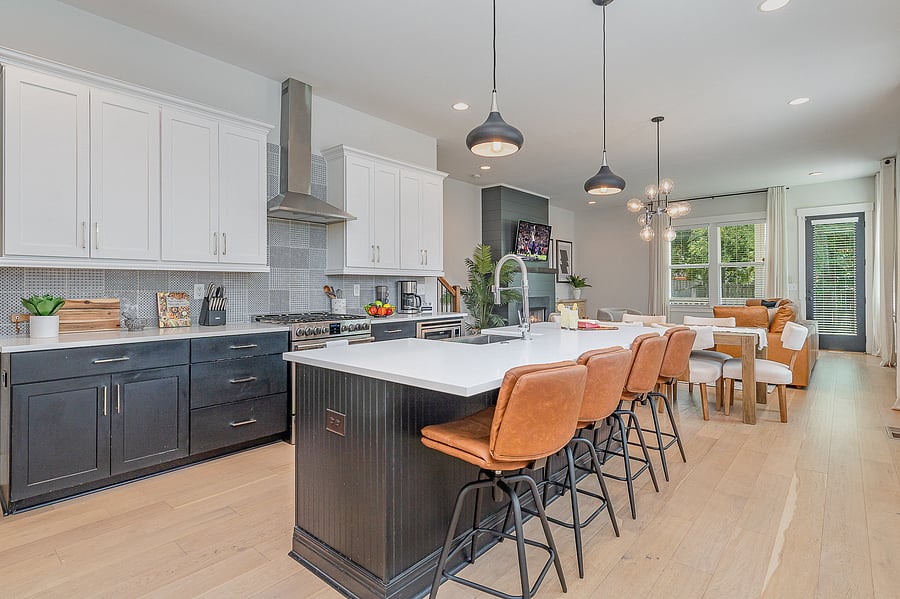 A fully equipped kitchen featuring stainless steel appliances, seating for four at the island, and all the essentials you need to cook and dine at home.