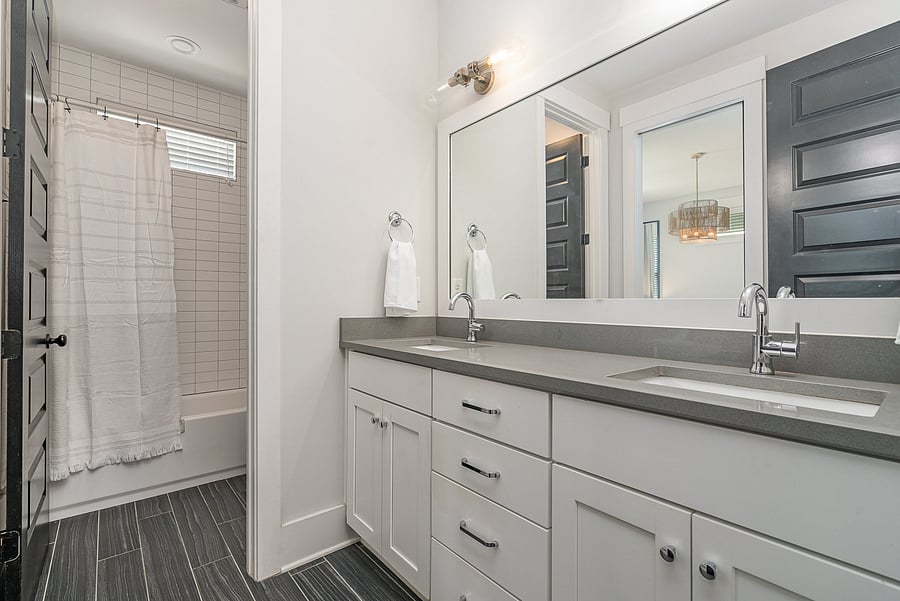 Bathroom 2 featuring a tub and shower combination on 2nd floor, close to bedrooms 2 + 3.
