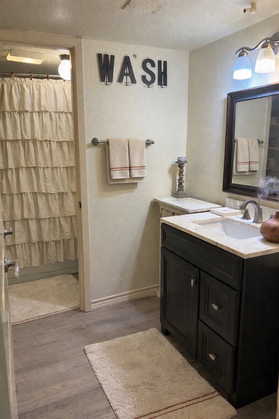 Stocked Bathroom & Closet: Full bath with bidet feature, plush towels, and generous organized closet storage space.