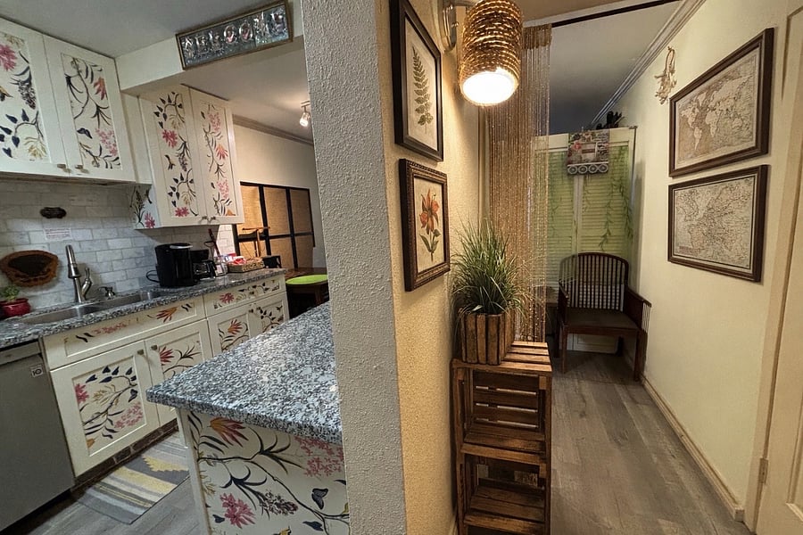 View from the front door: Welcoming entryway leading straight into the open kitchen and cozy living space.