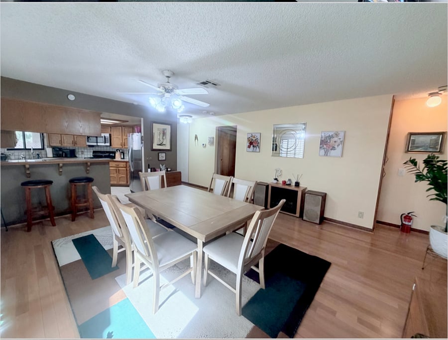 Dedicated dinning area that doubles as a quiet workspace, complete with an office desk, printer, high-speed Wi-Fi access, bright natural lighting.