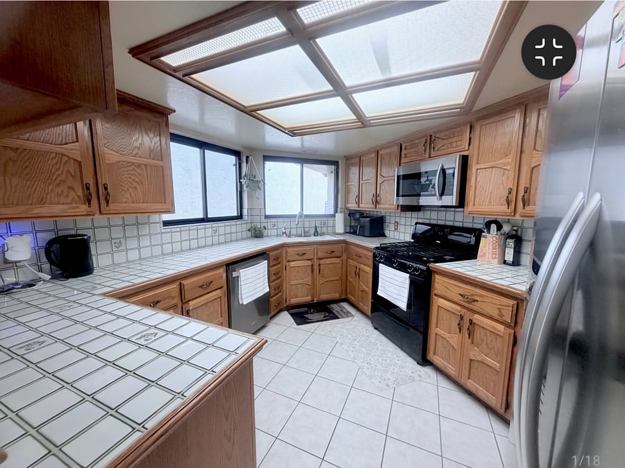 Fully stocked kitchen with a gas range,side-by-side stainless steel refrigerator, microwave built in and ample counter space. Includes premium small appliances like Vitamix blender, Cosiri Air fryer to make home cooking easy!