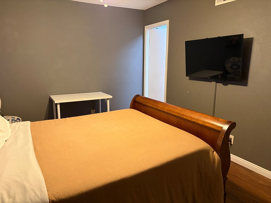 Queen size sleigh bed , smart TV with streaming channels included.