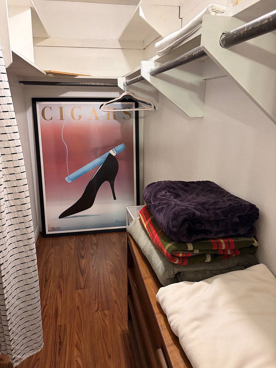 Master bedroom walk-in closet with dresser drawers