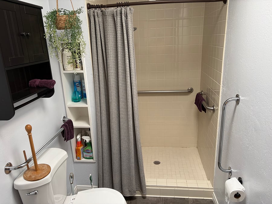 Master bathroom with walkin shower and pedestal sink