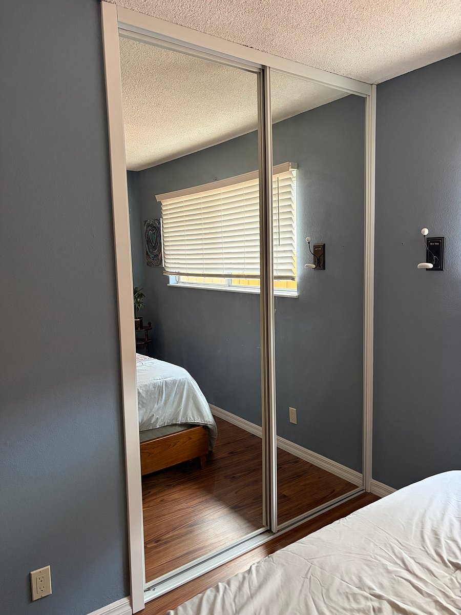 Mirrored bypass closet doors , good closet space.