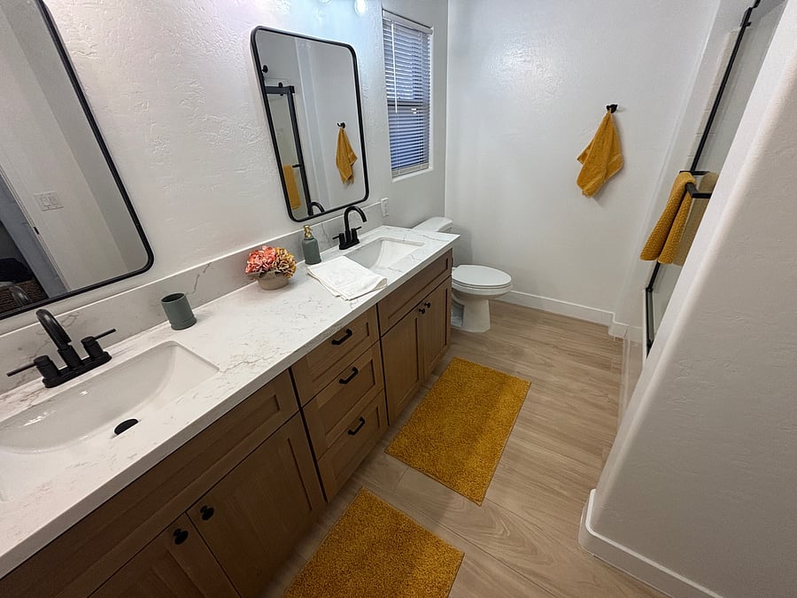 Bathroom 2 features full tub and shower, dual sinks, storage and beautiful finishes