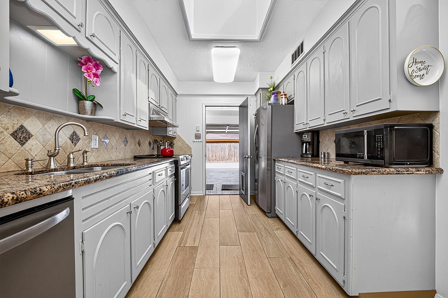 Kitchen leads into double Garage
