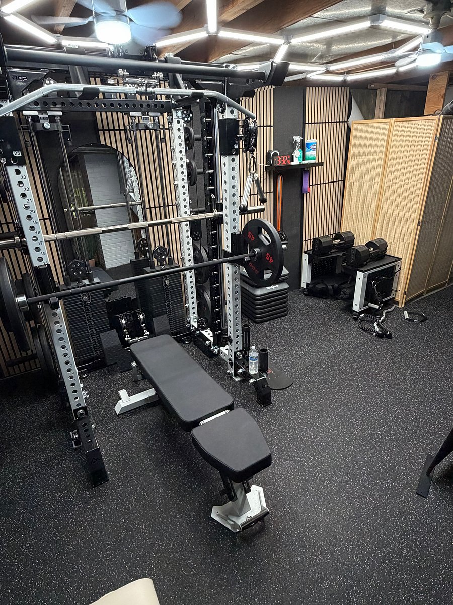 Complete gym with Power Rack, Adjustable Dumbbells, and Peloton treadmill