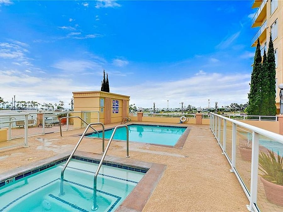 Resort-style building amenities including a swimming pool, hot tub and sauna