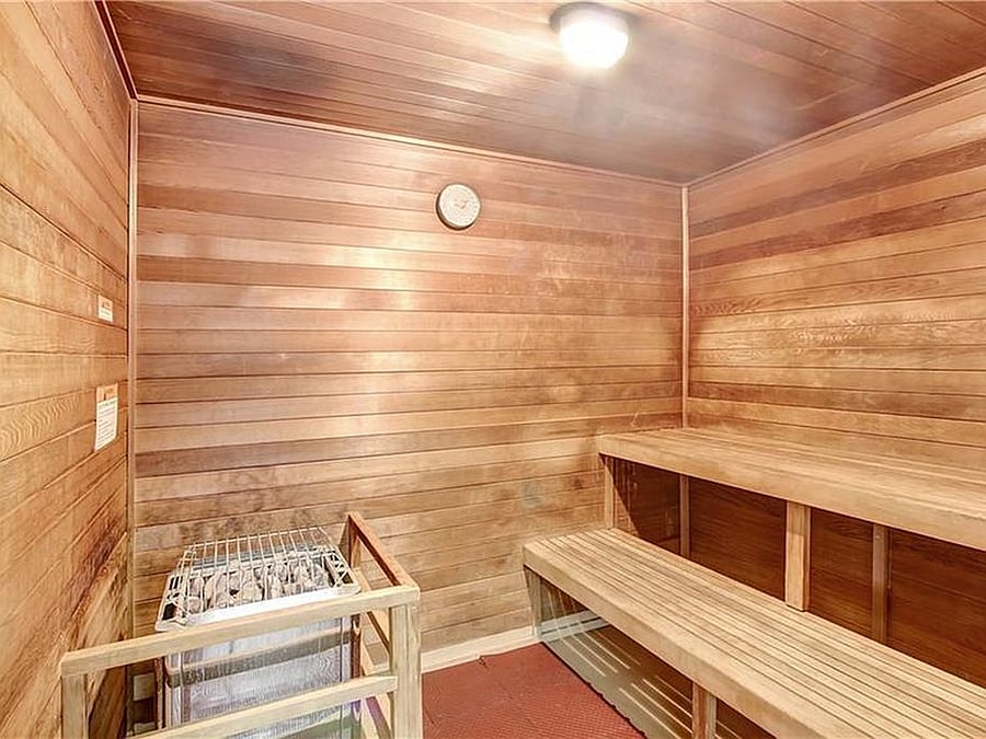 Resort-style building amenities including a swimming pool, hot tub and sauna