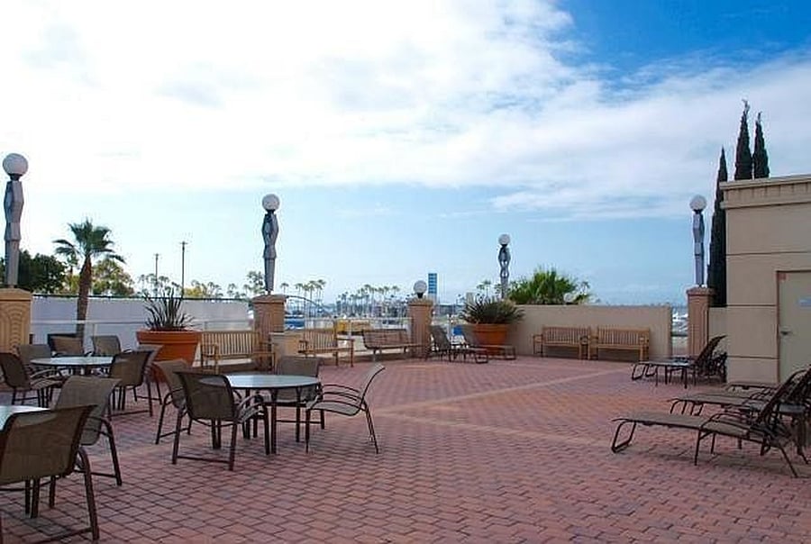 Resort-style building amenities including outdoor BBQ area