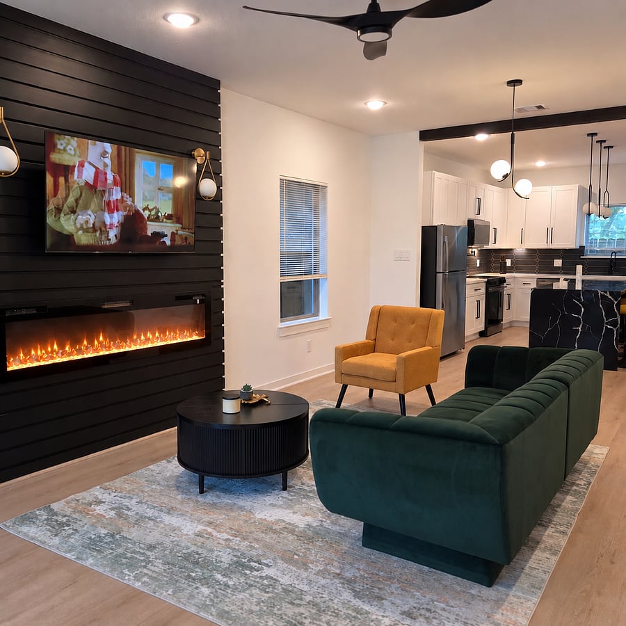 Living room/fireplace:
"Settle in and set the mood Our color-changing fireplace creates the perfect atmosphere for a cozy night in."