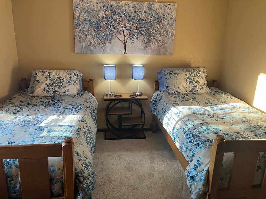 3rd bedroom upstairs. cozy comfortable double beds dresser and closet