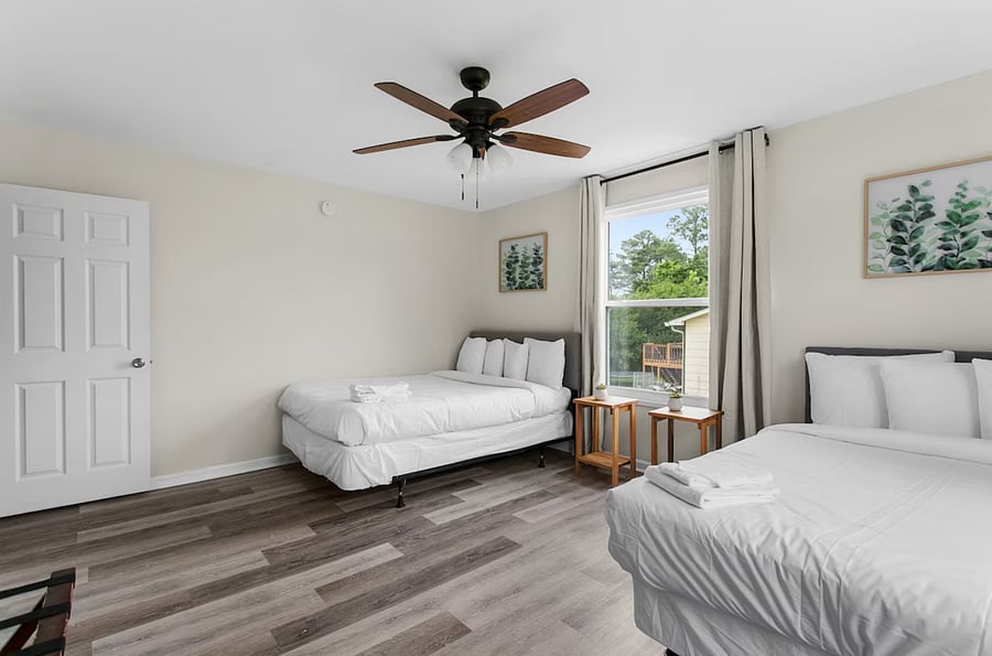 Enjoy flexible sleeping in this spacious bedroom featuring both a queen and a full bed-perfect for families or groups traveling together.