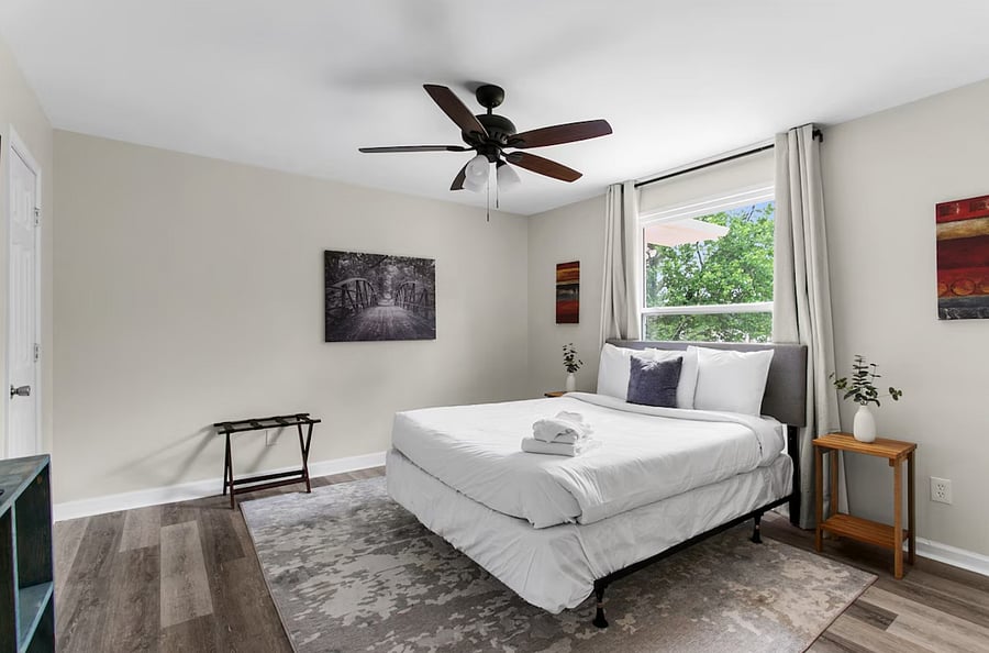 Unwind in a comfortable queen bedroom designed for rest and relaxation, offering a cozy retreat at the end of the day.