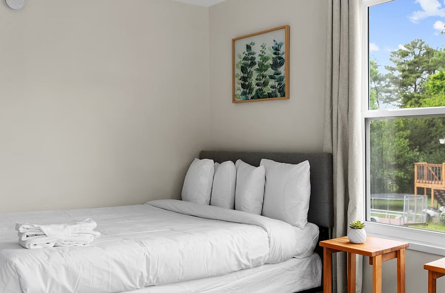 Designed with groups in mind, this bedroom combines a queen and full bed to maximize comfort and convenience without feeling crowded.