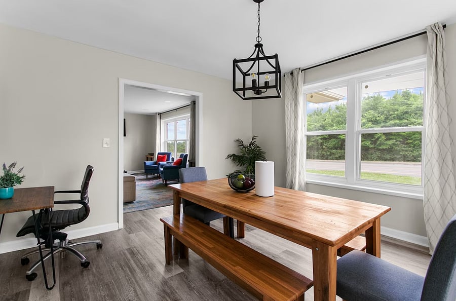 Catch up on work or plan your day at the nearby workspace, conveniently tucked just off the dining area.