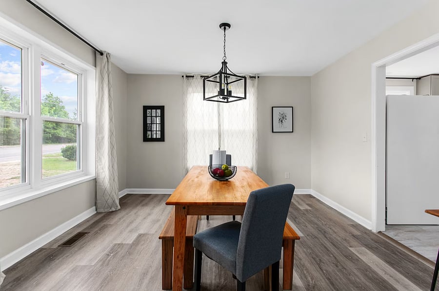Gather around the farmhouse-style dining table-perfect for shared meals, game nights, or planning your day in comfort.