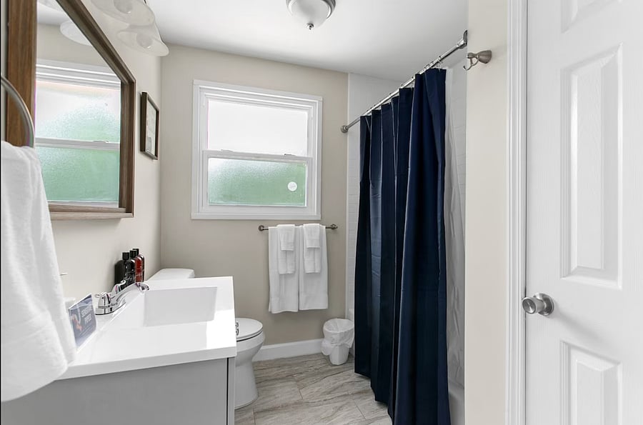 Enjoy a well-appointed full bathroom in Unit A with a convenient shower/tub combo, stocked with toiletries and ready to help you unwind after a long day.