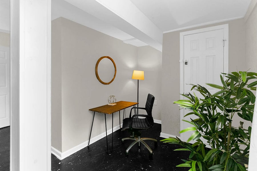 Stay productive at a dedicated workspace tucked within the twin bedroom in Unit B, partially separated by a wall to create a quiet, focused area.