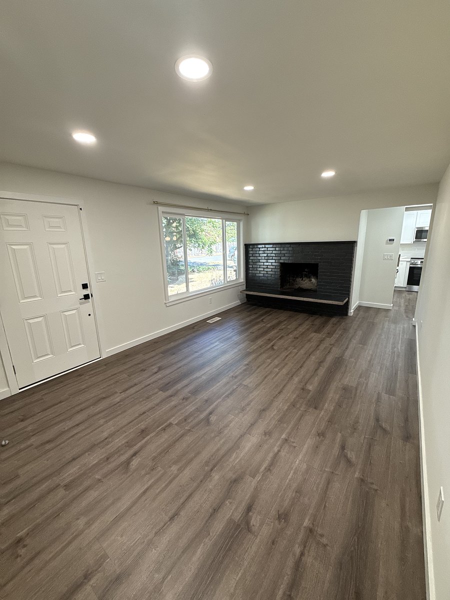 Main Living Room with wood-burning fireplace.