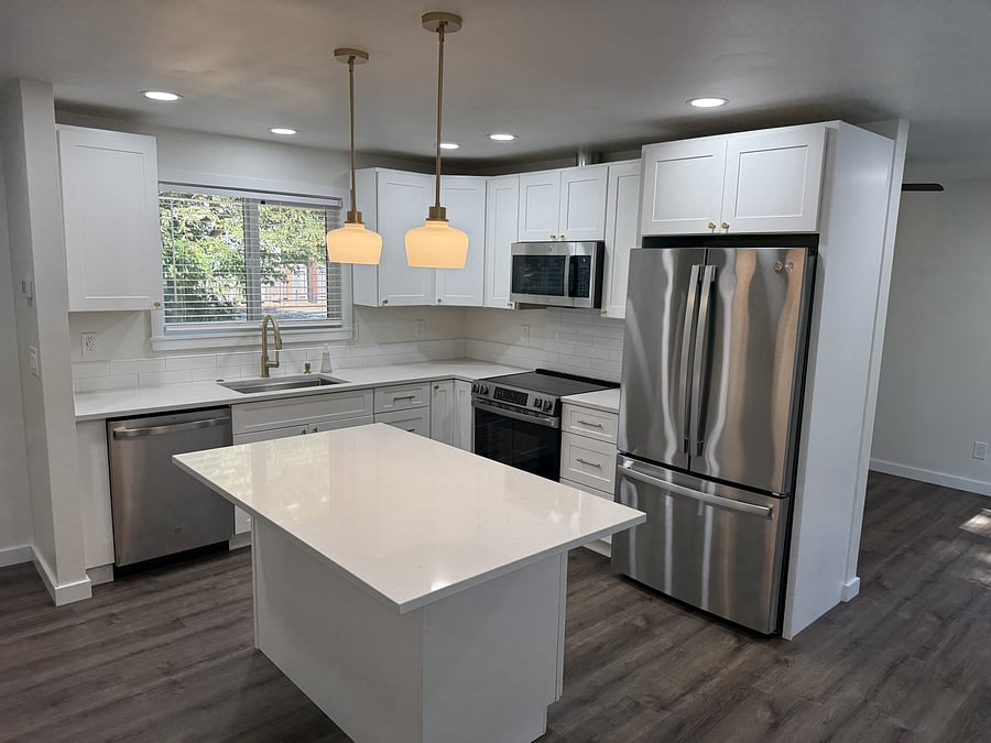 Fully equipped kitchen with stainless steel appliances.