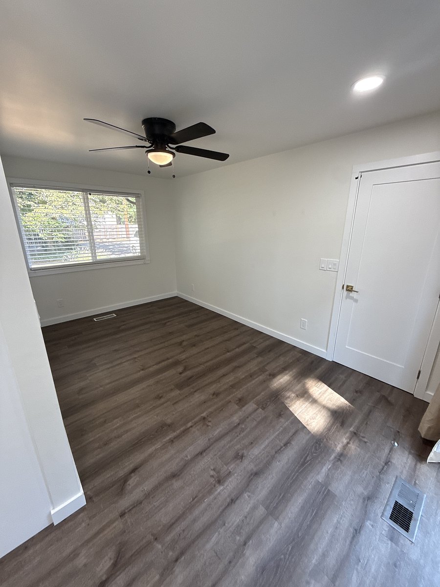 Dining Room, other angle, w/ceiling fan and sliding glass door to back patio.