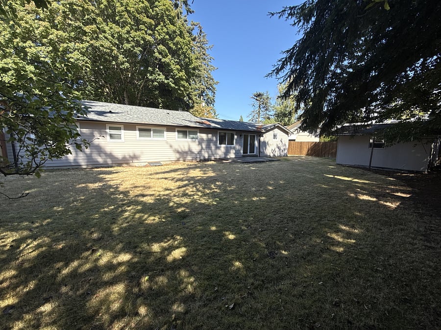 Fully fenced back yard, complete with locking storage shed.