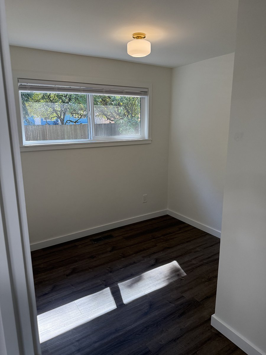 Designated office space just off the kitchen, the window faces the backyard.