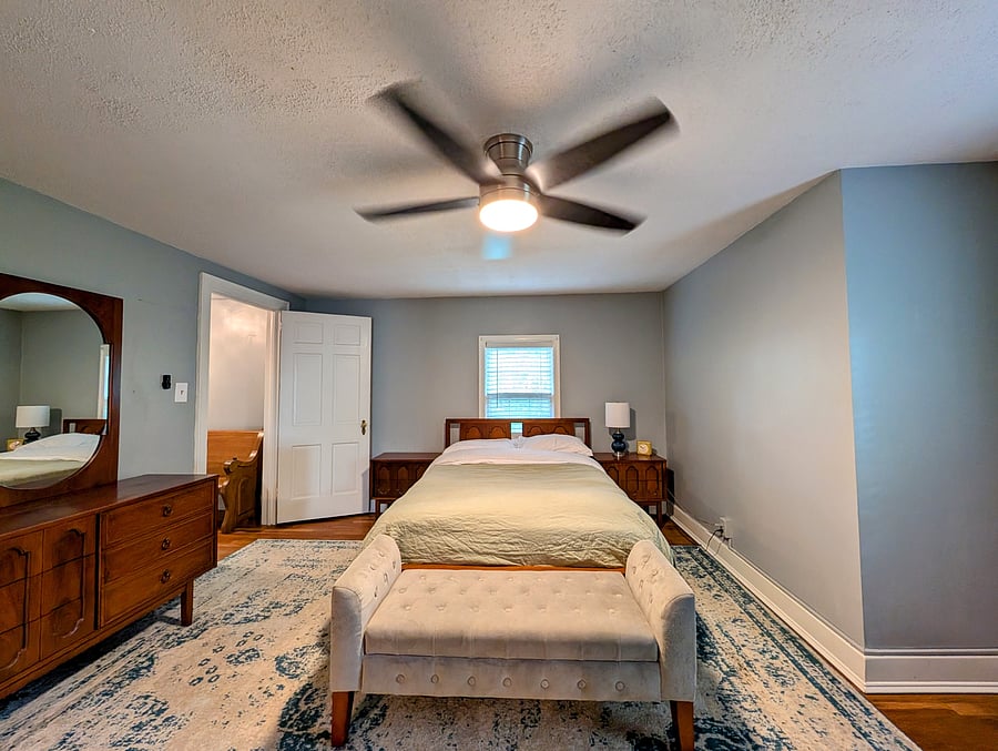 Upper level guest room with attached flex space.